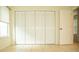 Spacious closet with bi-fold doors in bedroom at 6741 Willits Ave, New Port Richey, FL 34655