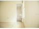 Simple bedroom with bathroom access and tile floor at 6741 Willits Ave, New Port Richey, FL 34655