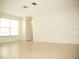 Bright living room with large windows and tile floor at 6741 Willits Ave, New Port Richey, FL 34655