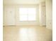 Spacious living room with large windows and tile floors at 6741 Willits Ave, New Port Richey, FL 34655