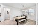 Spacious dining area with a rustic wooden table and bench seating at 7480 Pool Compass Loop, Wesley Chapel, FL 33545