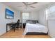 Bright bedroom with a comfortable bed and workspace at 8615 Magnolia Dr, Seminole, FL 33777