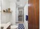 Modern bathroom with a glass shower, patterned floor, and a floating shelf, offering a clean aesthetic at 912 Channelside Dr # 2601, Tampa, FL 33602