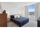 Bright bedroom with a large window and city views, furnished with a comfortable bed and modern decor at 912 Channelside Dr # 2601, Tampa, FL 33602