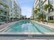 Refreshing community pool between modern buildings, offering a relaxing and scenic environment at 912 Channelside Dr # 2601, Tampa, FL 33602