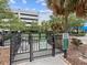 Well-maintained dog run area with secure fencing and waste disposal for pet-friendly living at 912 Channelside Dr # 2601, Tampa, FL 33602