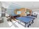 Spacious game room with a pool table, ping pong table, and comfortable seating areas at 912 Channelside Dr # 2601, Tampa, FL 33602