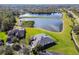 Aerial view of two houses and a lake at 9202 Everwood Ct, Tampa, FL 33647