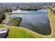 Community features a serene lake with lush green surroundings at 9202 Everwood Ct, Tampa, FL 33647