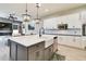 Modern kitchen with white cabinets, large island, farmhouse sink, and stainless steel appliances at 9202 Everwood Ct, Tampa, FL 33647