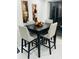 Kitchen dining area with four-chair table and dark wood top at 11511 Meredith Ln, Port Richey, FL 34668