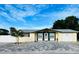Inviting single-story home with a paved driveway and well-manicured lawn at 11511 Meredith Ln, Port Richey, FL 34668
