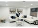 L shaped living room with white sectional and marble flooring at 11511 Meredith Ln, Port Richey, FL 34668