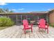 Spacious screened-in patio with pavers, string lights, and comfortable furniture for outdoor living at 1307 Windjammer Pl, Valrico, FL 33594