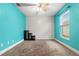 Bedroom featuring a vibrant turquoise wall, neutral walls, and a window for natural light at 1307 Windjammer Pl, Valrico, FL 33594
