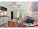Bedroom boasts a comfortable bed, ample natural light, and an adjacent dresser at 1307 Windjammer Pl, Valrico, FL 33594