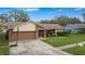 One-story home with attached garage and basketball hoop at 1307 Windjammer Pl, Valrico, FL 33594