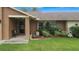 Landscaped front yard with welcoming porch and entryway at 1307 Windjammer Pl, Valrico, FL 33594