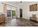 Bright room with sliding doors to outdoor patio, wood-look floors, and stylish decor at 1307 Windjammer Pl, Valrico, FL 33594