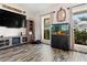 Living area featuring built-in cabinets, a large aquarium, and wood-look floors at 1307 Windjammer Pl, Valrico, FL 33594