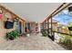 A covered patio with string lights, comfortable seating, and a fan for outdoor comfort at 1307 Windjammer Pl, Valrico, FL 33594