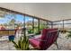 Relaxing screened patio with brick flooring, comfortable seating, and ambient string lights at 1307 Windjammer Pl, Valrico, FL 33594