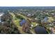 Aerial view showcasing the golf course and neighborhood at 14625 Par Club Cir, Tampa, FL 33618
