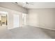 Main bedroom with ceiling fan and access to bathroom at 14625 Par Club Cir, Tampa, FL 33618