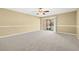 Living room with carpeting and access to patio at 14625 Par Club Cir, Tampa, FL 33618