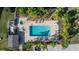 Community pool with surrounding patio and lounge chairs at 14625 Par Club Cir, Tampa, FL 33618