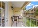 Small balcony with table and chairs, overlooking courtyard at 17960 Gulf Blvd # 115, Redington Shores, FL 33708