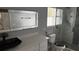Updated bathroom with modern vanity, walk-in shower, and stylish fixtures at 18229 Port Side St, Tampa, FL 33647