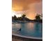 Enjoy a refreshing dip in this community pool at sunset at 18229 Port Side St, Tampa, FL 33647