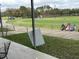 Golf driving range with multiple stations and golfers at 18229 Port Side St, Tampa, FL 33647