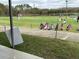 Golf driving range with multiple stations and golfers at 18229 Port Side St, Tampa, FL 33647