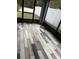 Enclosed patio with wood-look tile flooring at 18229 Port Side St, Tampa, FL 33647