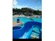 Large community pool with water slide and multiple areas at 18229 Port Side St, Tampa, FL 33647