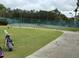 Well-maintained tennis courts with surrounding green space at 18229 Port Side St, Tampa, FL 33647