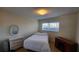 Bright bedroom with a double bed and built-in dresser at 2348 Shelley St # 4, Clearwater, FL 33765