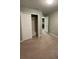 Bedroom with a closet and an open door to the laundry room at 2409 Hearth Dr, Odessa, FL 33556