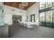 Open clubhouse featuring high ceilings, stylish lighting, and a long communal table at 2409 Hearth Dr, Odessa, FL 33556