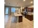 Kitchen with stainless appliances, island and granite counters at 2409 Hearth Dr, Odessa, FL 33556