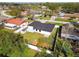 Aerial view of a house, backyard, and surrounding neighborhood at 26728 Hickory Loop, Lutz, FL 33559
