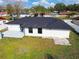 Aerial view of a house with a backyard and a shed at 26728 Hickory Loop, Lutz, FL 33559