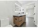 Contemporary bathroom with floating vanity and a sleek mirror at 26728 Hickory Loop, Lutz, FL 33559