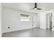 Spacious bedroom with grey tile floor and walk-in closet at 26728 Hickory Loop, Lutz, FL 33559