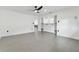 Modern bedroom featuring ample closet space and gray tile floors at 26728 Hickory Loop, Lutz, FL 33559