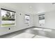 Bright bedroom with grey tile floors and a ceiling fan at 26728 Hickory Loop, Lutz, FL 33559