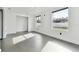 Bright bedroom with grey tile floors and large windows at 26728 Hickory Loop, Lutz, FL 33559