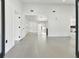 Bright entryway with grey tile floors and views into the living areas at 26728 Hickory Loop, Lutz, FL 33559